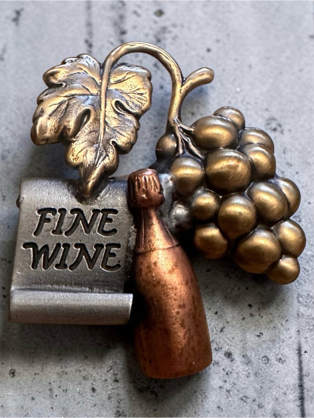 Vintage “Fine Wine” brooch signed by K & T